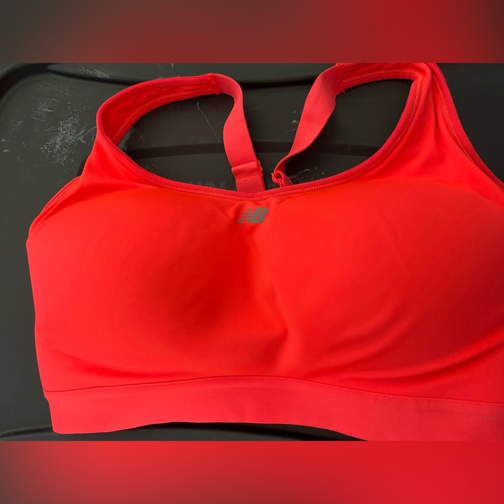 New without tags. New Balance Vibrant Red Sports Bra